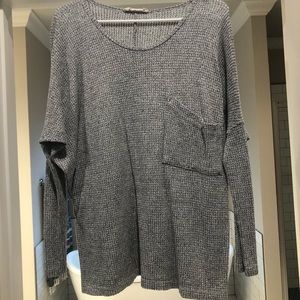 Loose fitting, light weight, pocket sweater